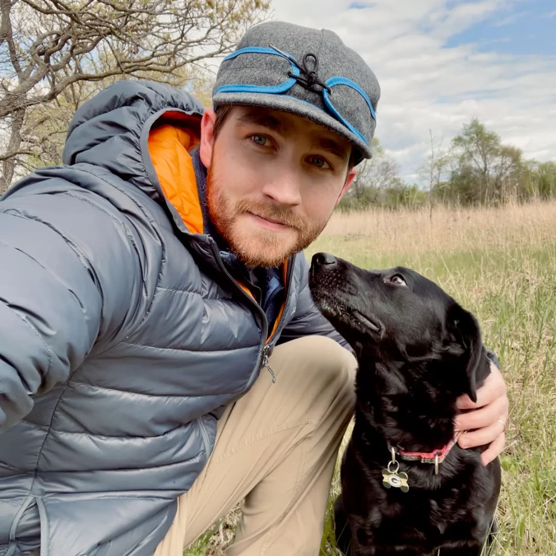 Michael Schlecht outdoors with his dog, Mia